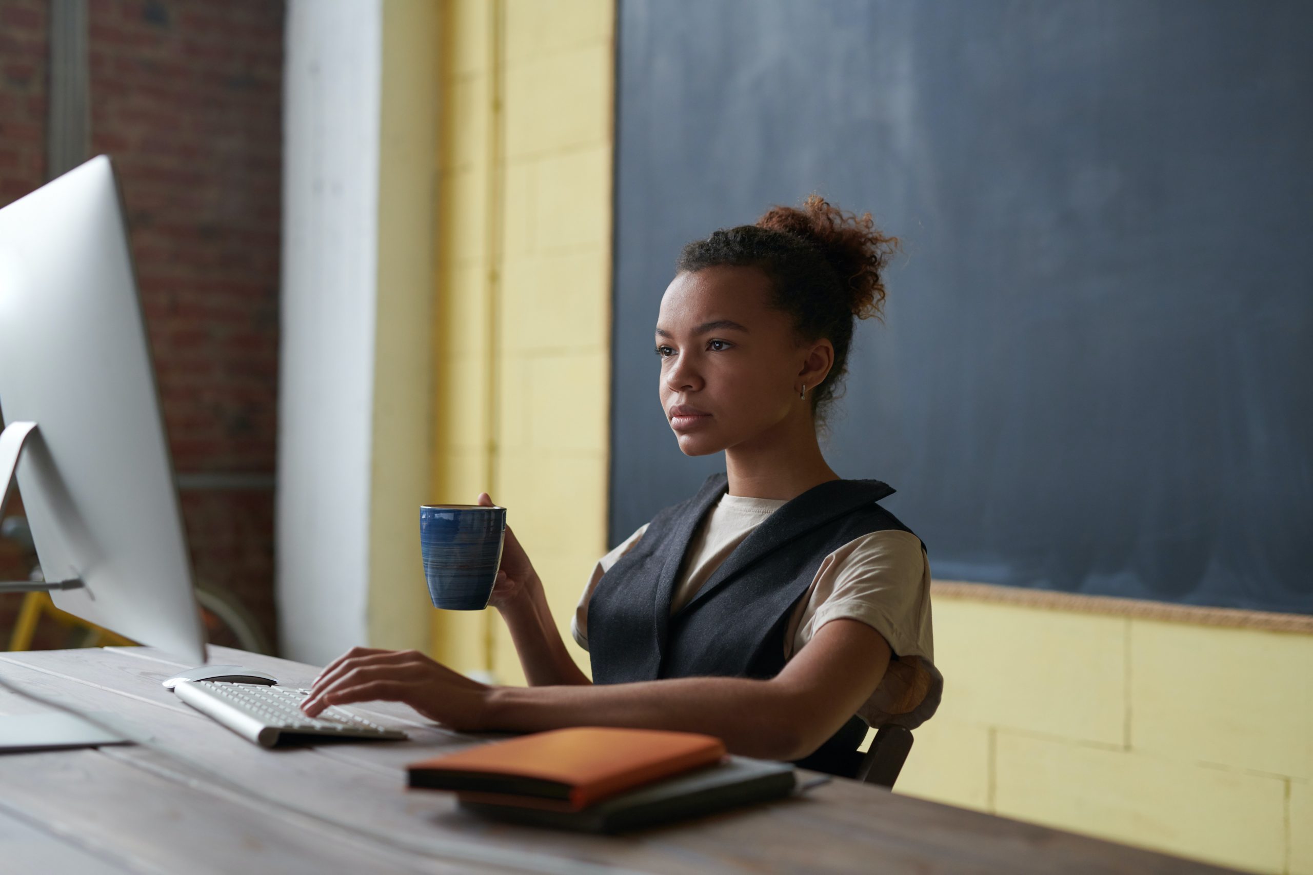 teacher sitting at desk