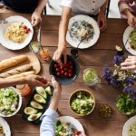 friends gathered at table for a meal