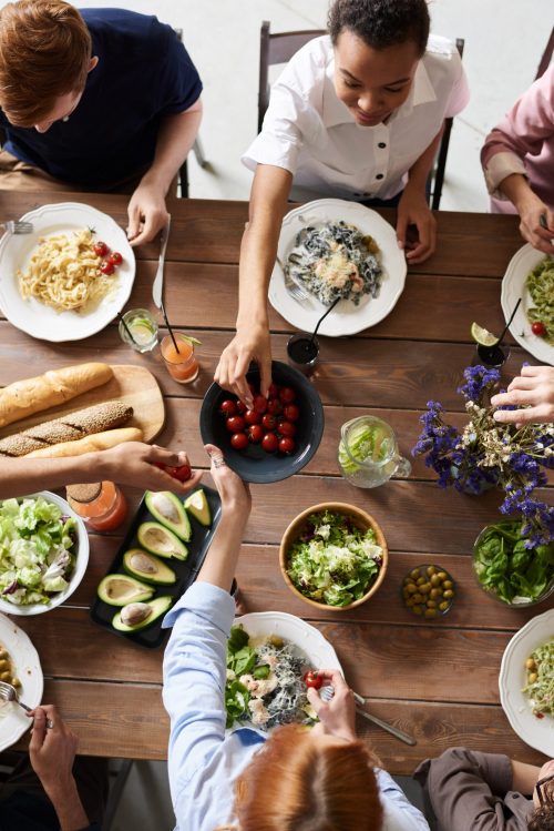 friends gathered at table for a meal